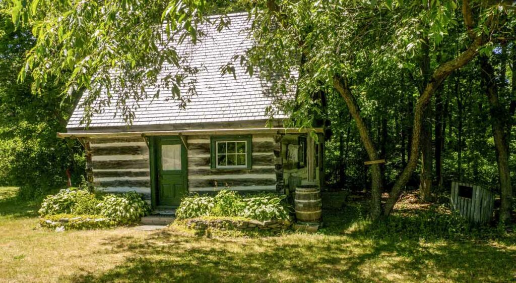 A furnished two-storey log  cabin, built in 1867, forms part of several mini-museums that may be visited on the grounds of the Pioneer Museum in Mindemoya. Photo by Isobel Harry.