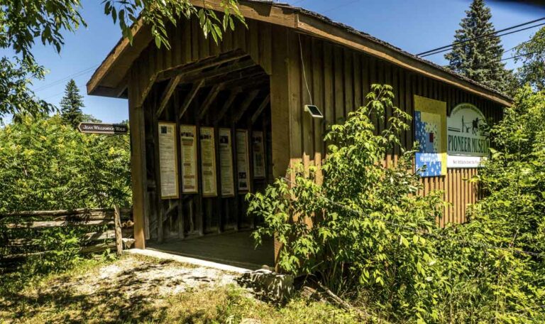 The covered bridge at Mindemoya’s Pioneer Museum is a gallery for the display of local family trees that extend from the settler days of the 1860s to the present day. Photo by Isobel Harry.