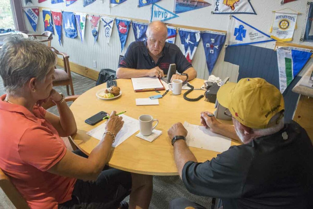 Donations from boaters and local businesses such as the Anchor Inn, Dreamers’ Cove, Turners, the Little Current Yacht Club and help from volunteers keep the Cruisers’ Net on the air year after year. Here, volunteers help to record some of the 5,217 calls received in 2019. Expositor file photo. 