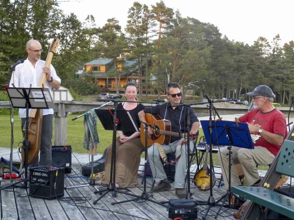 At Huron Island Time, a diverse music program on the boardwalk includes local musicians, such as the Kagawong Folk Roots Collective (pictured), 
and touring acts. Photo by Isobel Harry