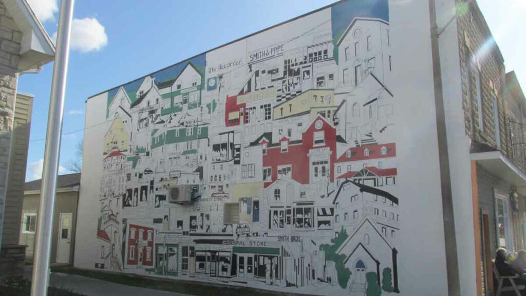 The mural in Gore Bay depicts the town’s business and institutional community buildings over the last half of the twentieth century.