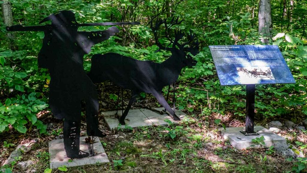 Positioned along the trail are evocative iron sculptures depicting scenes of prehistoric life and descriptive signs of the geological formations to be found in the Archaeological Site. 
Photo by Isobel Harry.